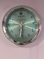OYSTER PERPETUAL Wall Clock IN SILVER Crome stainless steel with black face.