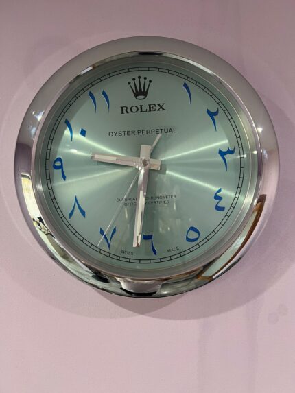 OYSTER PERPETUAL Wall Clock IN SILVER Crome stainless steel with black face.